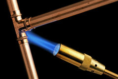 plumbing-blowtorch-flame-black-background-45055637.jpg