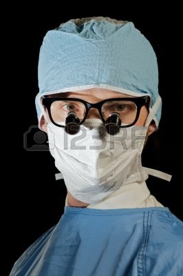 5002351-serious-surgeon-in-scrubs-and-magnifying-microsurgery-glasses.jpg