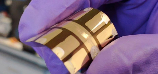 A close-up of a flexible solar module developed at Swansea University. The technology can be printed directly onto a flexible base, making it cheaper to manufacture and suitable for more applications than traditional solar cells.