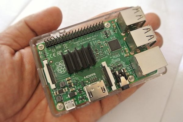A close-up of a held Raspberry Pi microcontroller